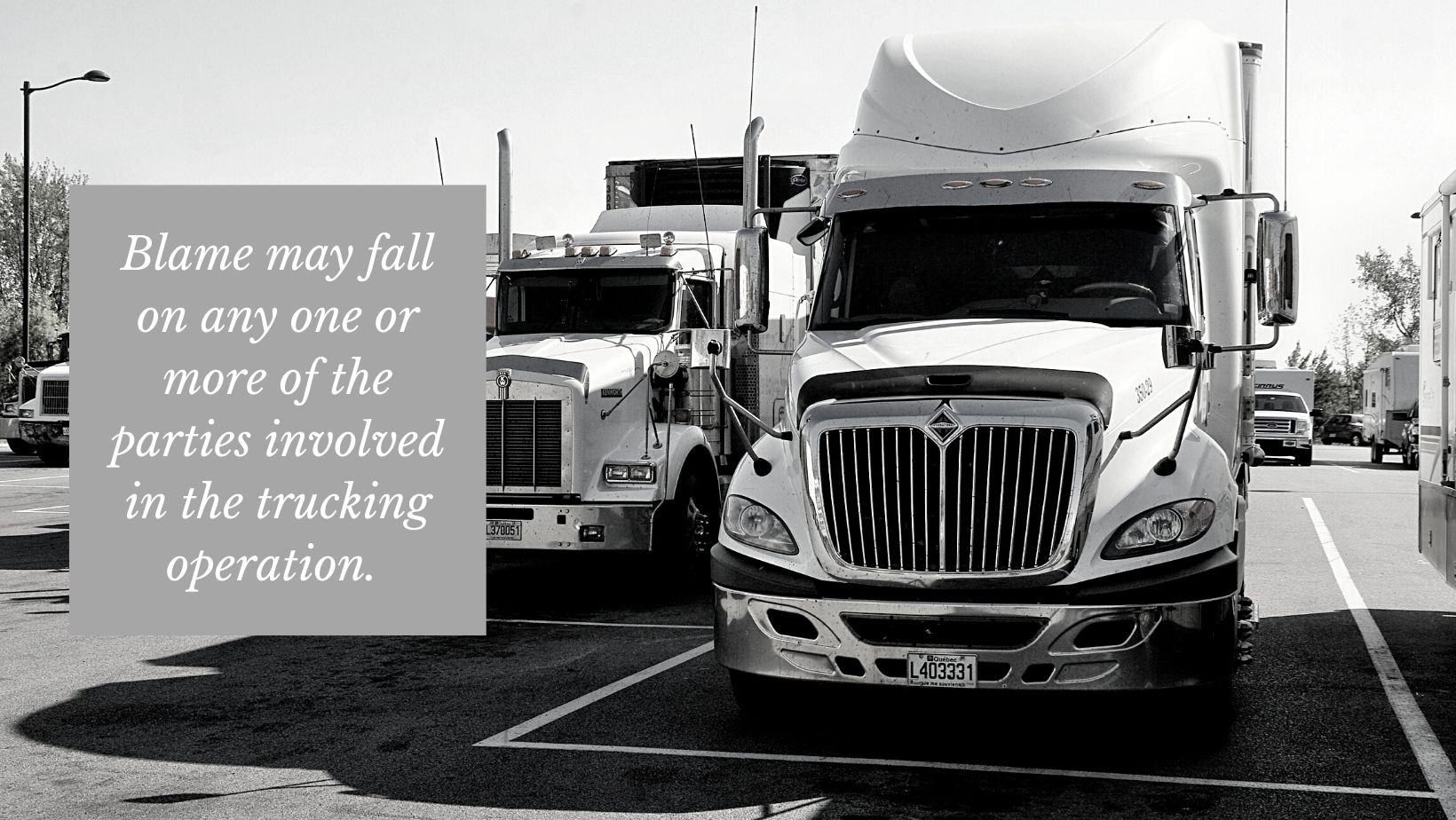 trucks in a parking lot of trucking company