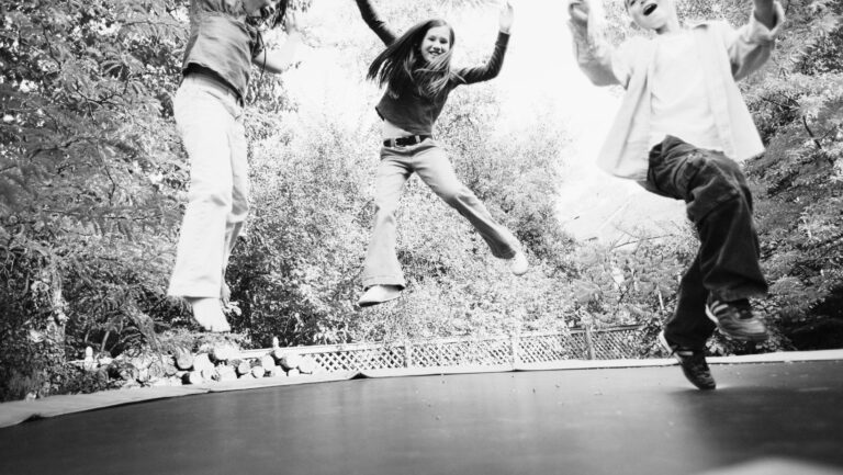 children on a trampoline before an accident