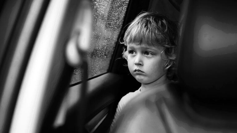 a cute little blond boy looking out of the car win 2024 12 05 08 26 06 utc in category Uncategorized